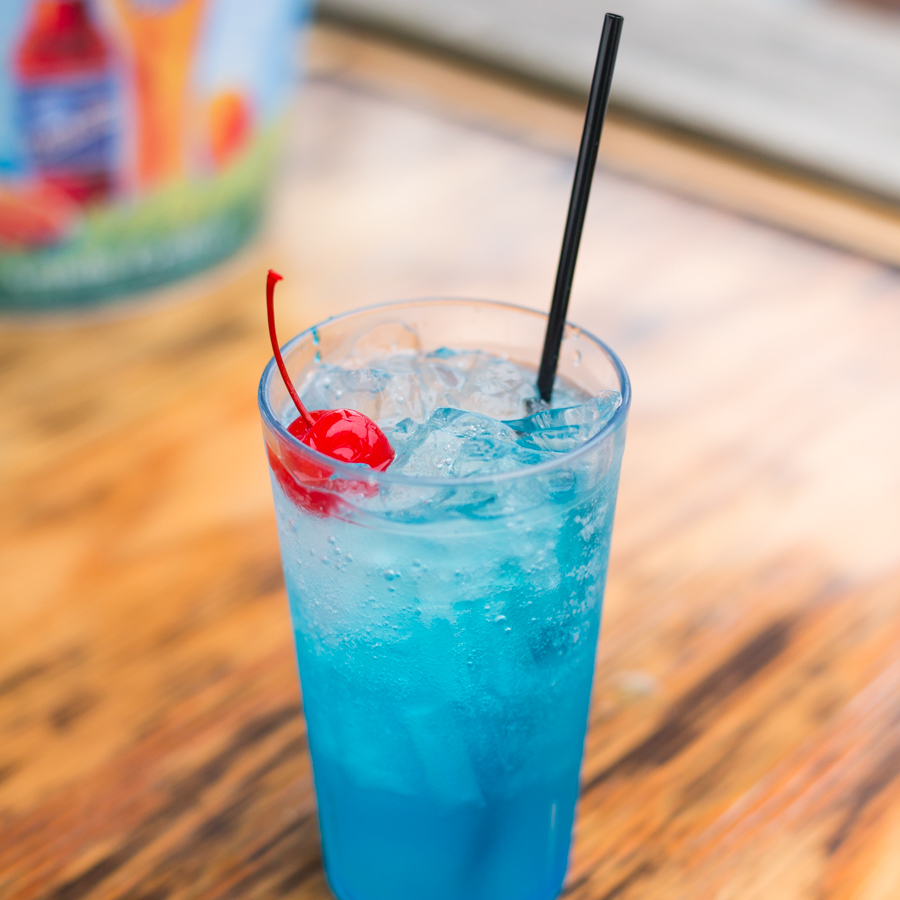 Electric Lemonade 7 an electrifying fusion of citron vodka, blue curacao & sweet & sour, topped